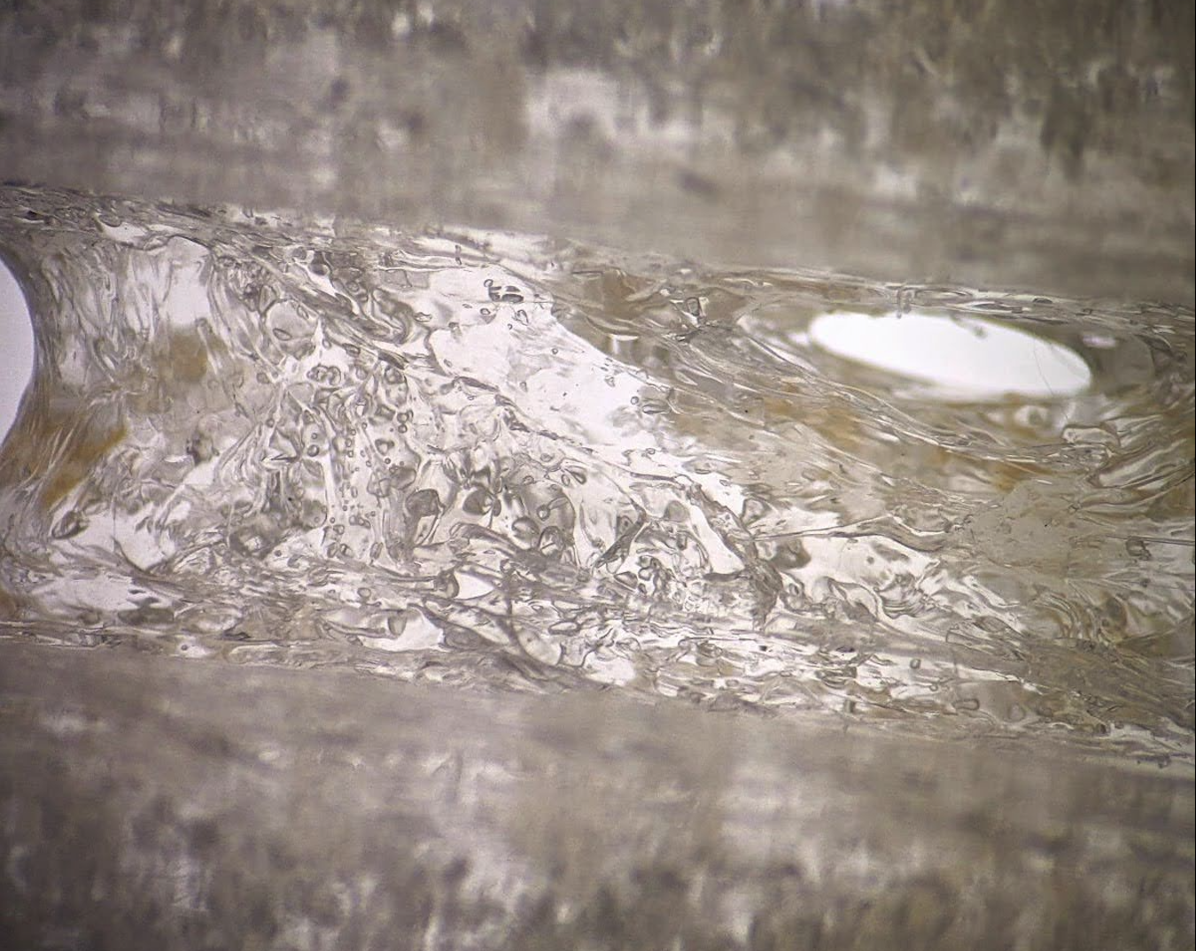 Microscopic view of a PC print full of bubbles