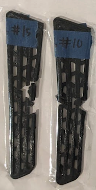 Two fractured PETG brace support peices